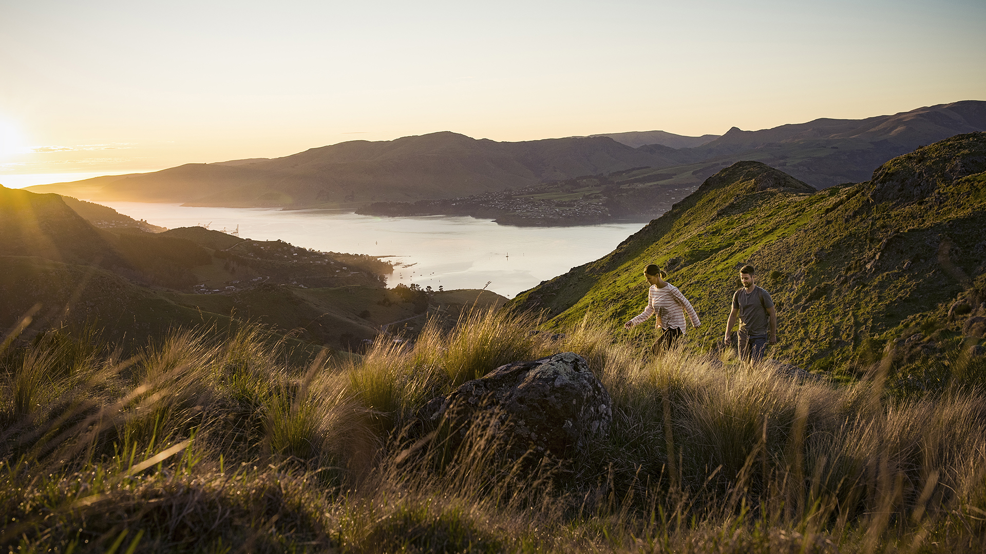 Couples hiking in the hills overlooking Christchurch New Zealand