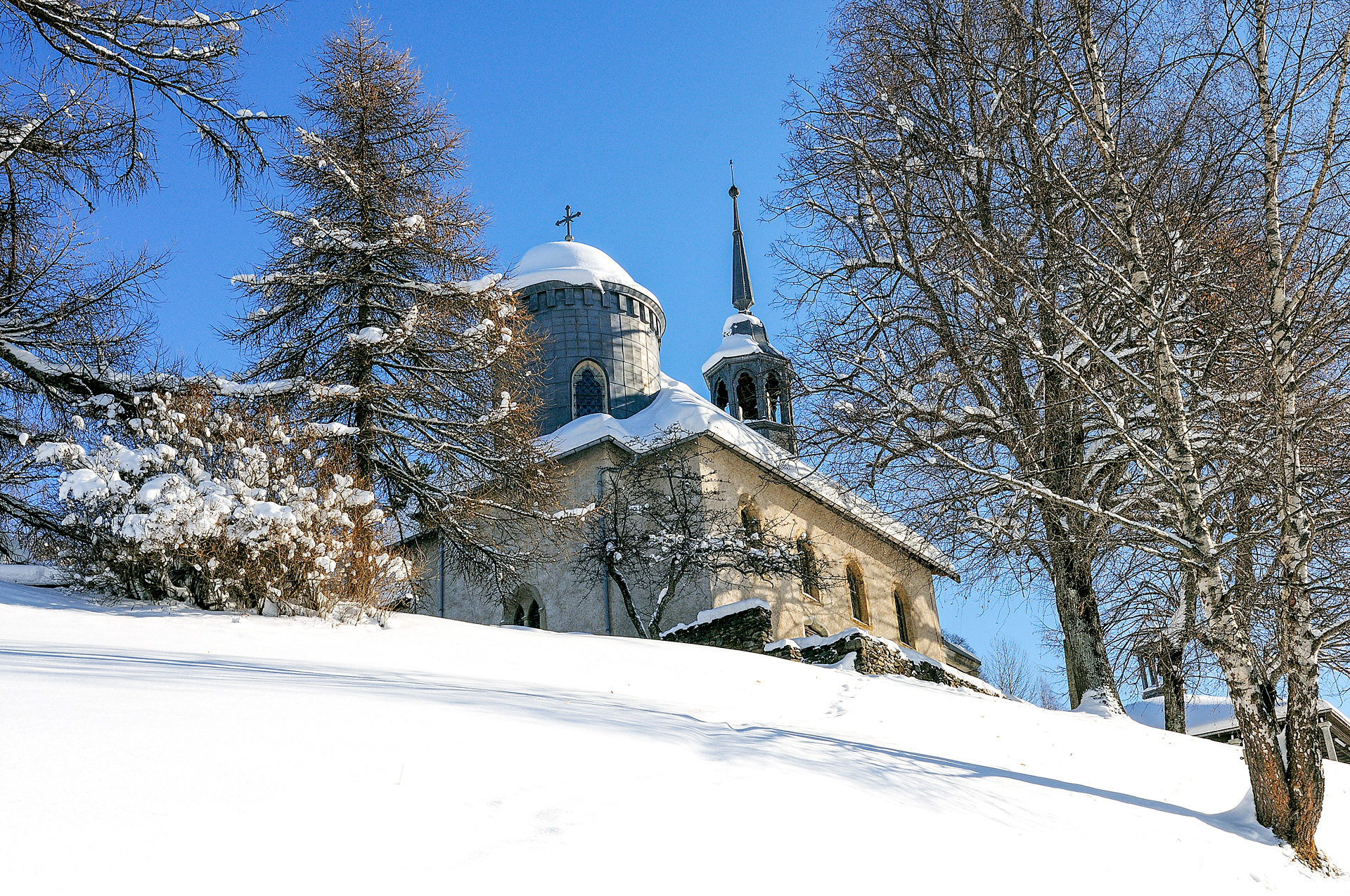 A church up a hill covered in snow