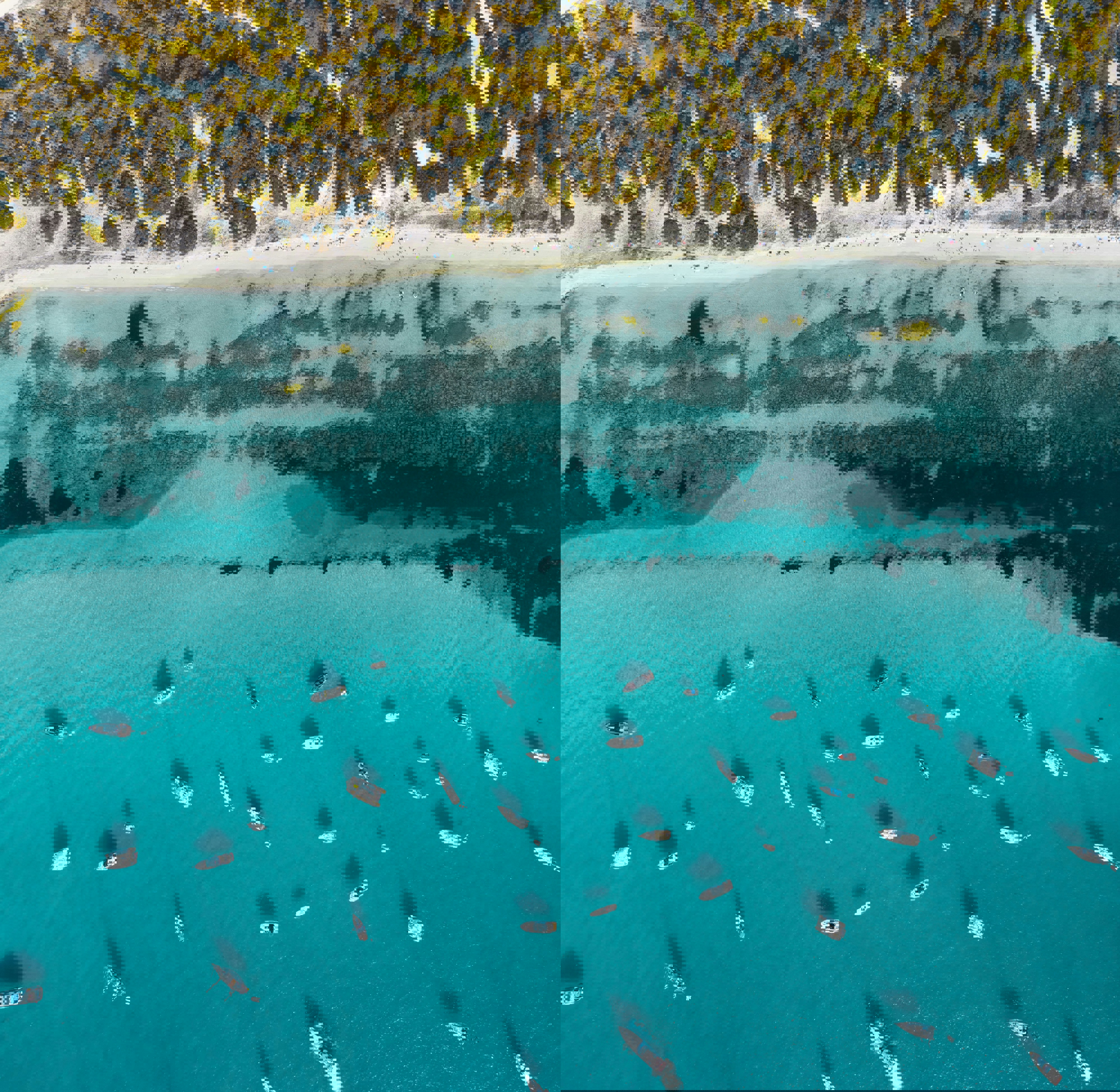 An aerial view of the coastline of Formentera with boats anchored in the ocean
