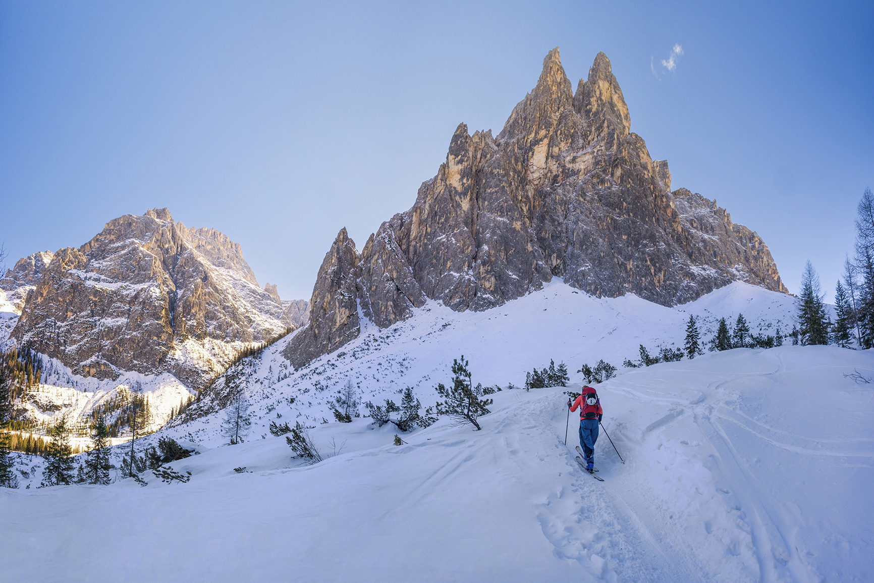 Skier trekking through the snow in the Dolomites