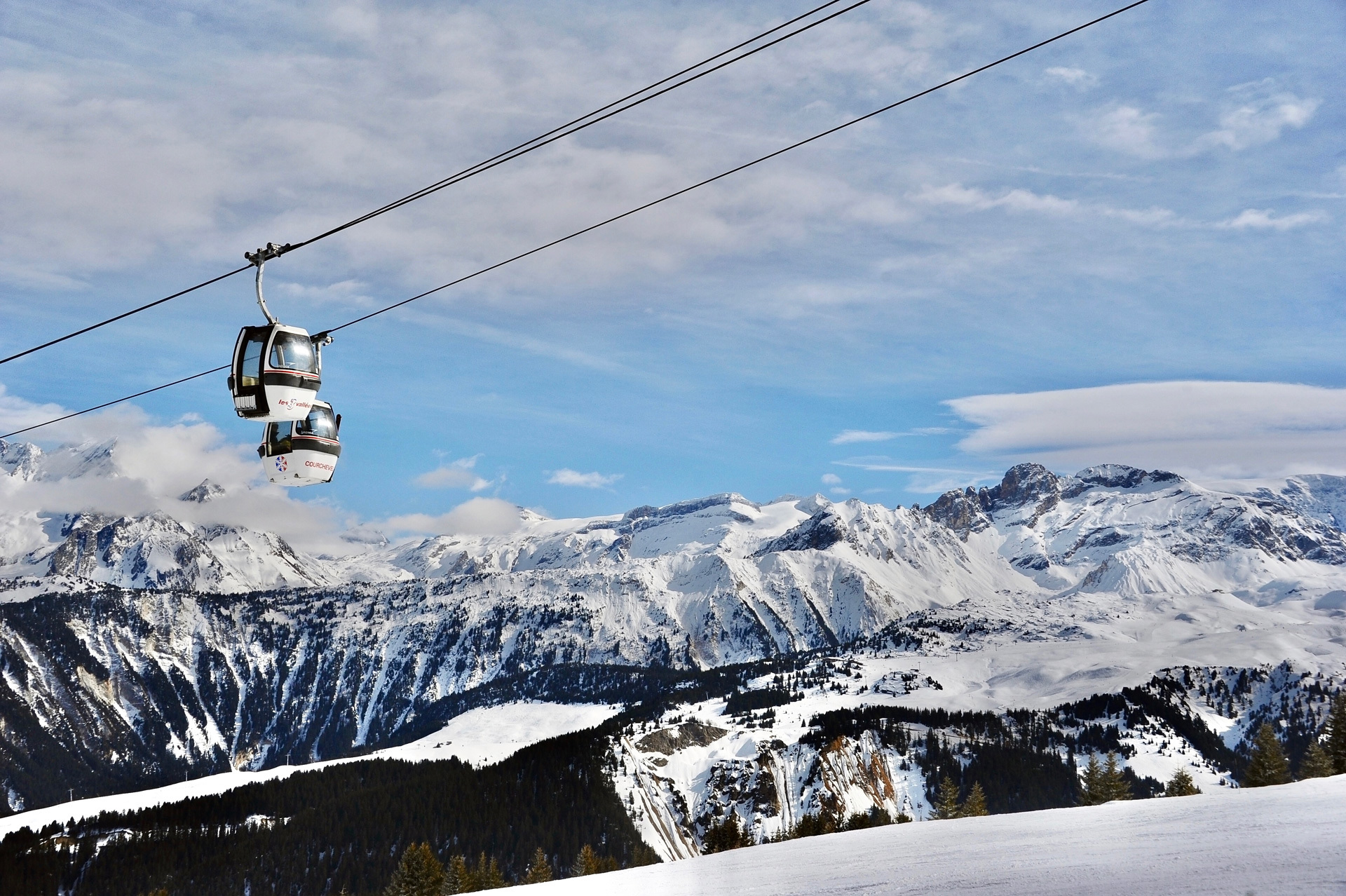 Ski gondolas over Courchevel ski resort in winter