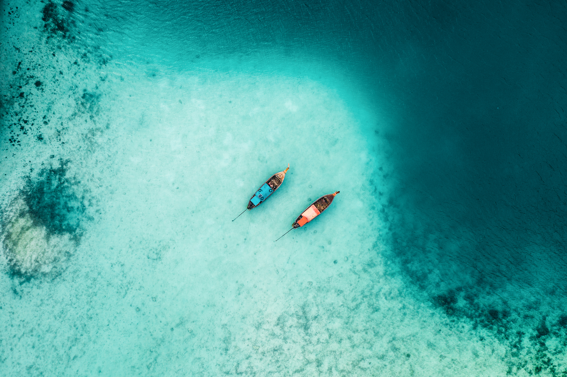Scenic aerial view of two boats in clear water