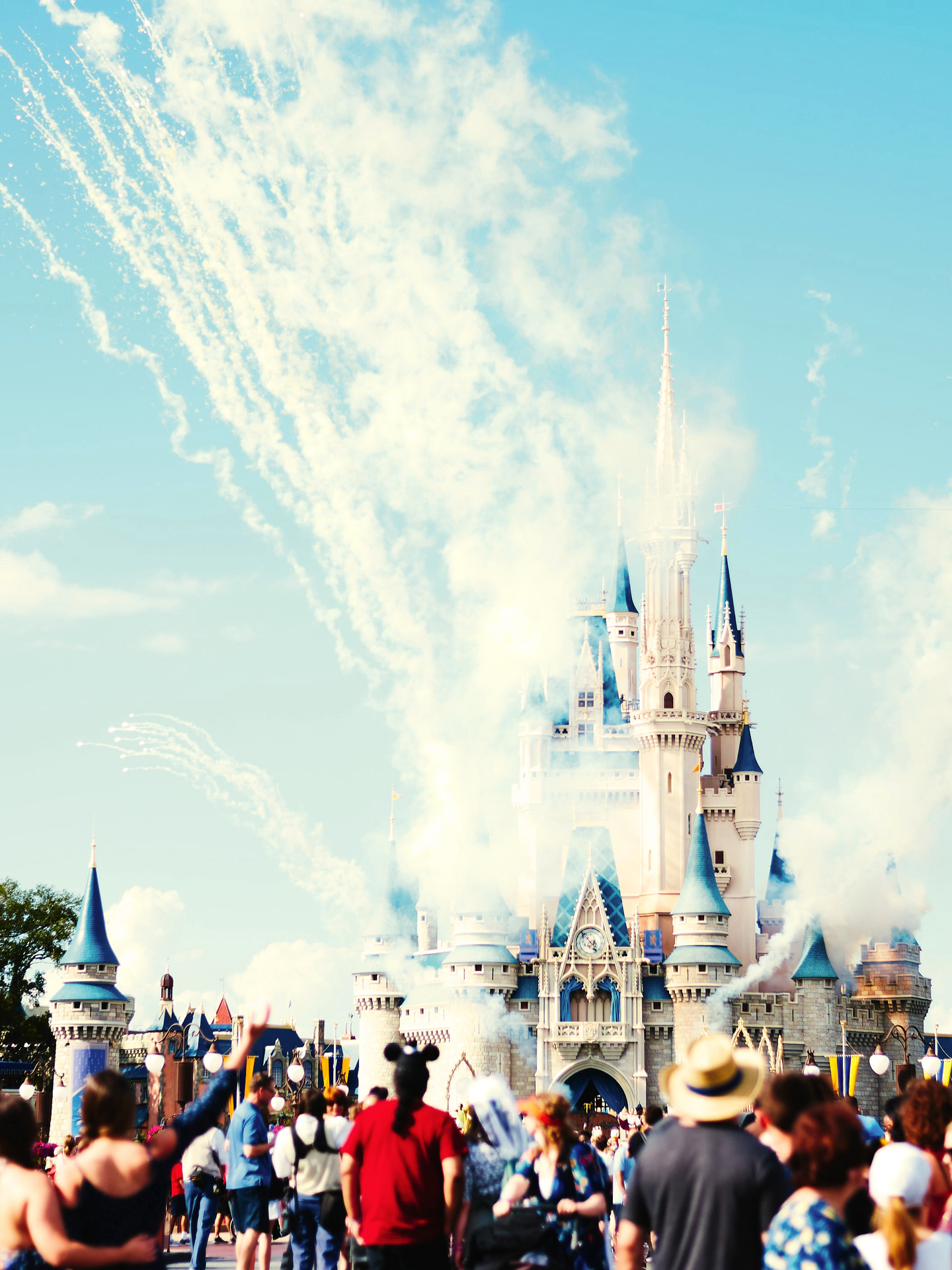 Out of focus people looking towards the Cinderalla Castle at Disneyland