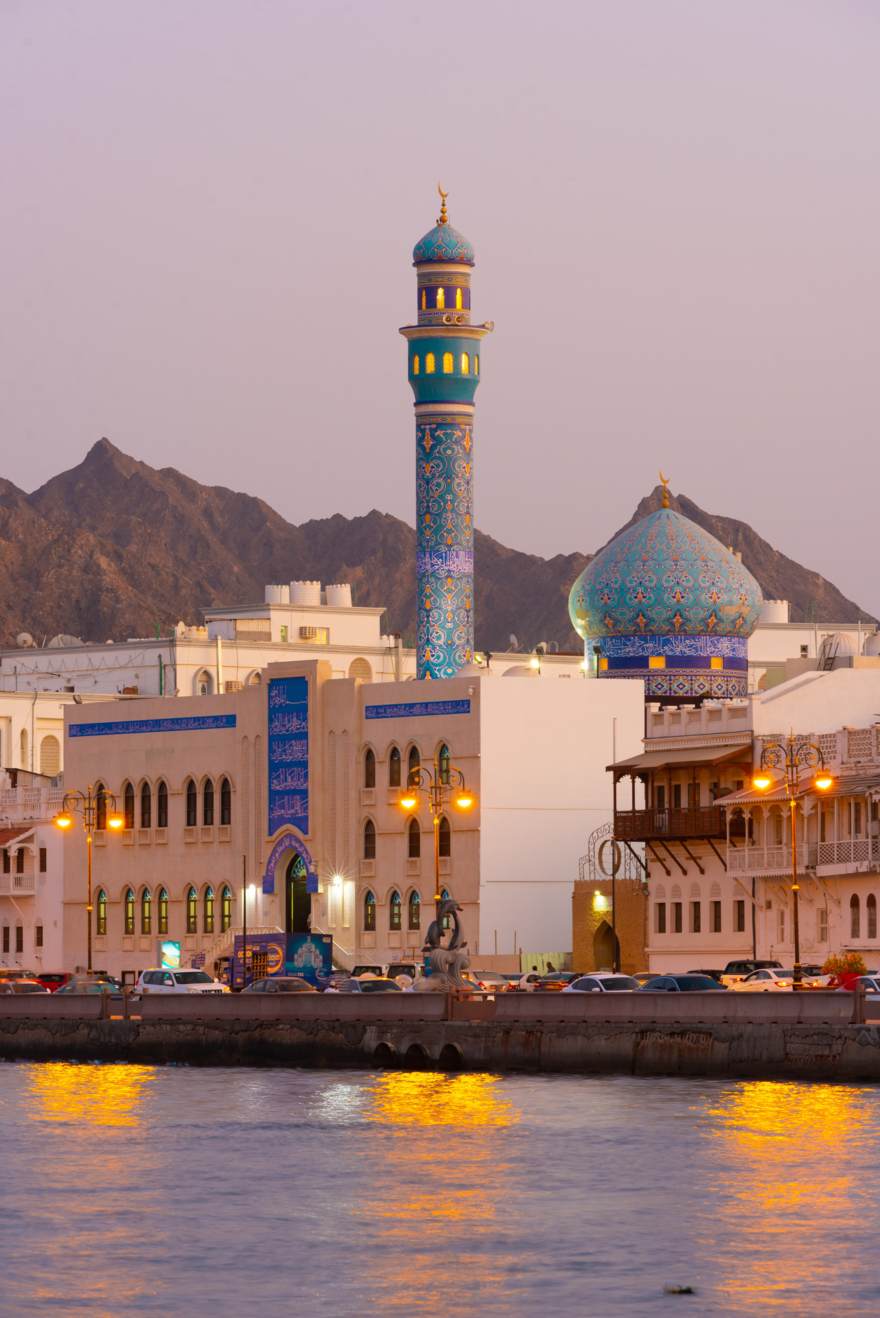 View of muscat street and buildings from across water