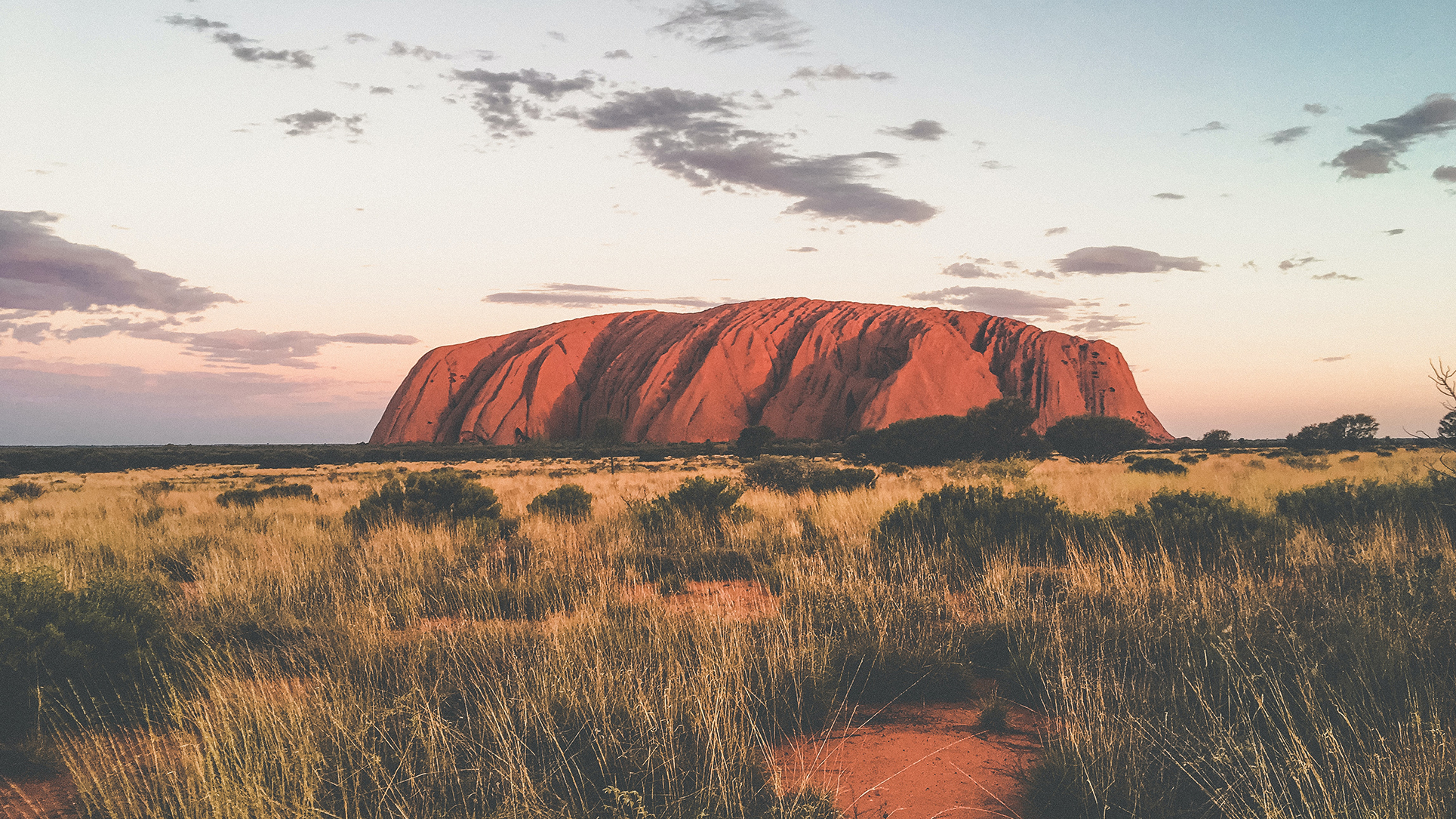 Rock formation of Uluru at sunset