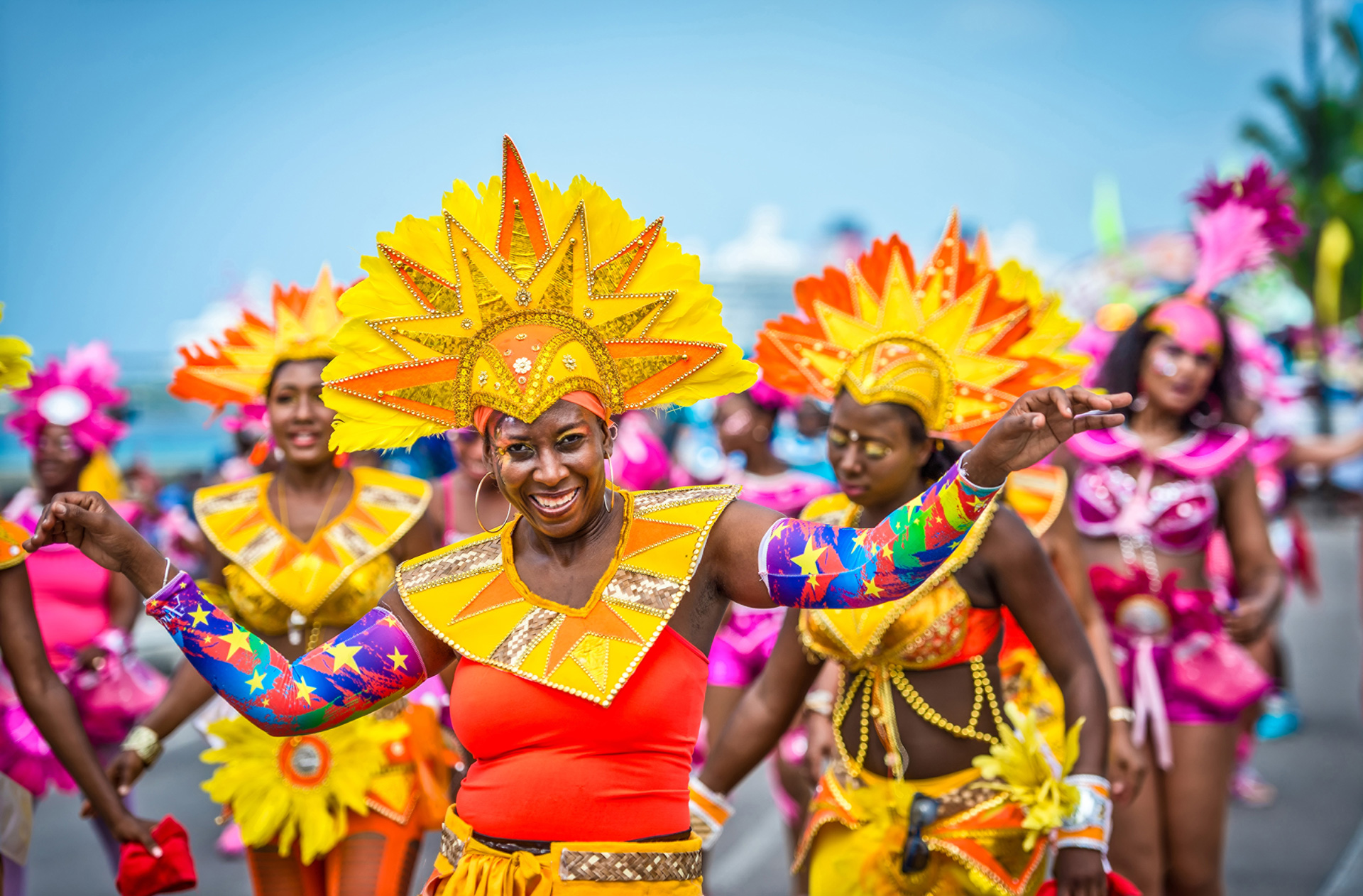 Woman in bright carnival clothing celebrating Jukanoo in the Bahamas