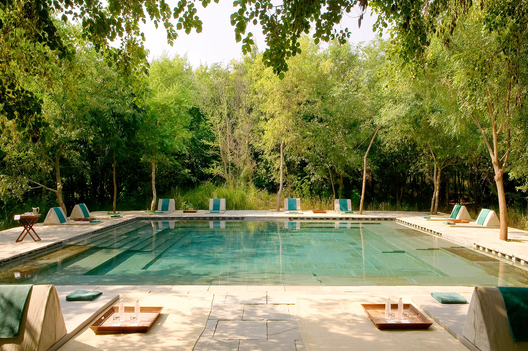 Asia, India, Aman-i-Khas, step well square swimming pool with sun loungers on all sides