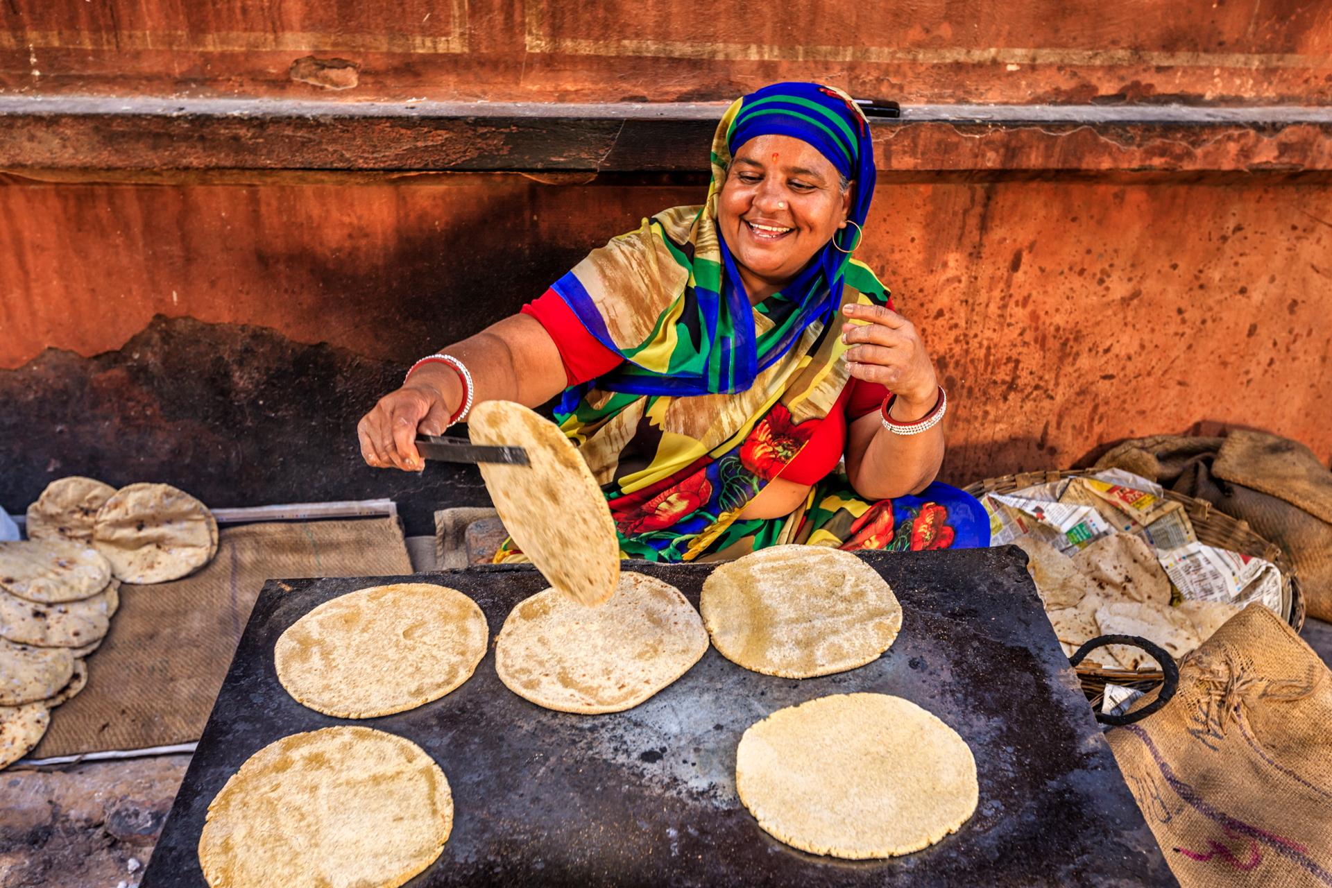 Indian street vendor preparing food - chapatti, flat bread, Jaipur