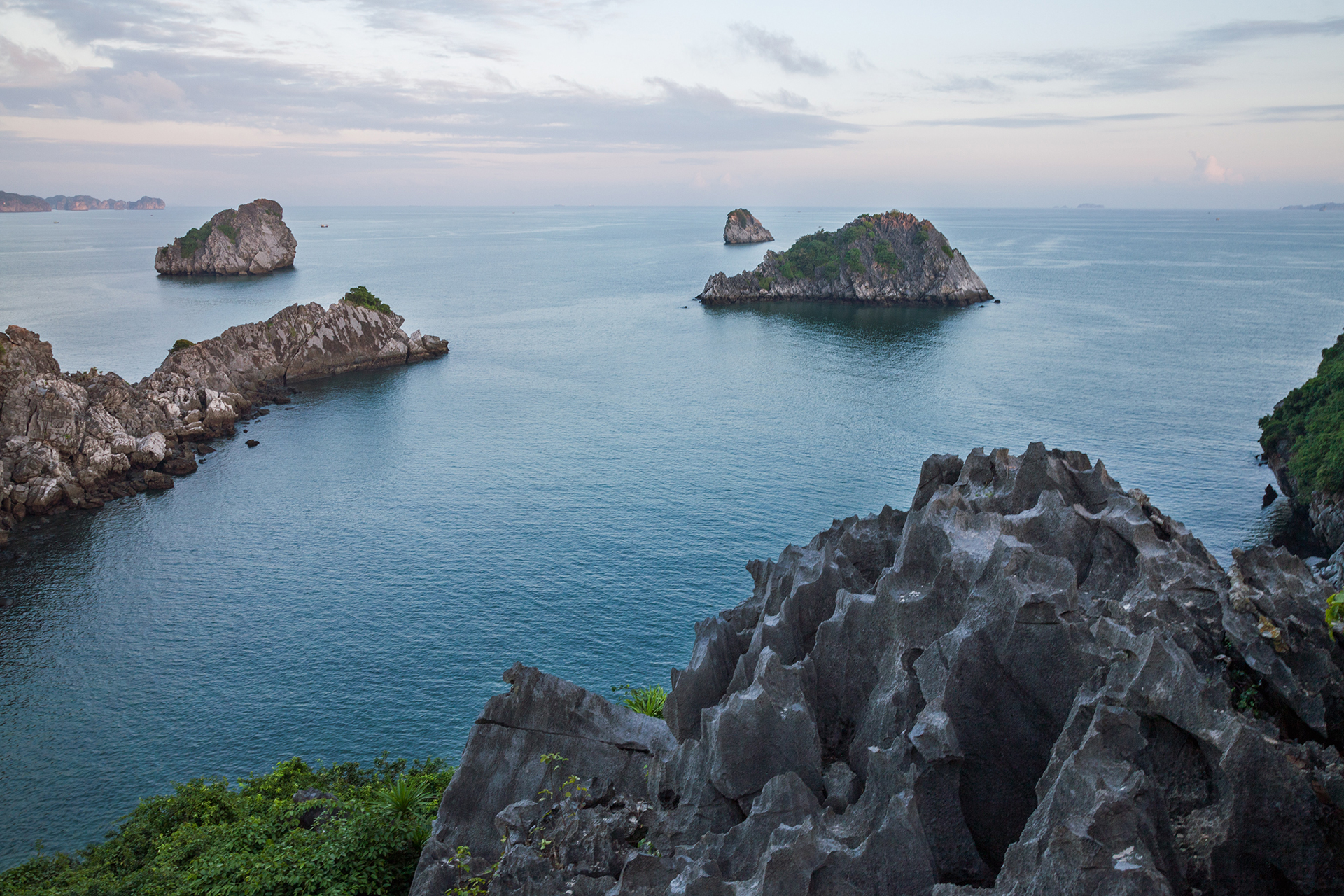 Gray rocky coastline beside blue sea