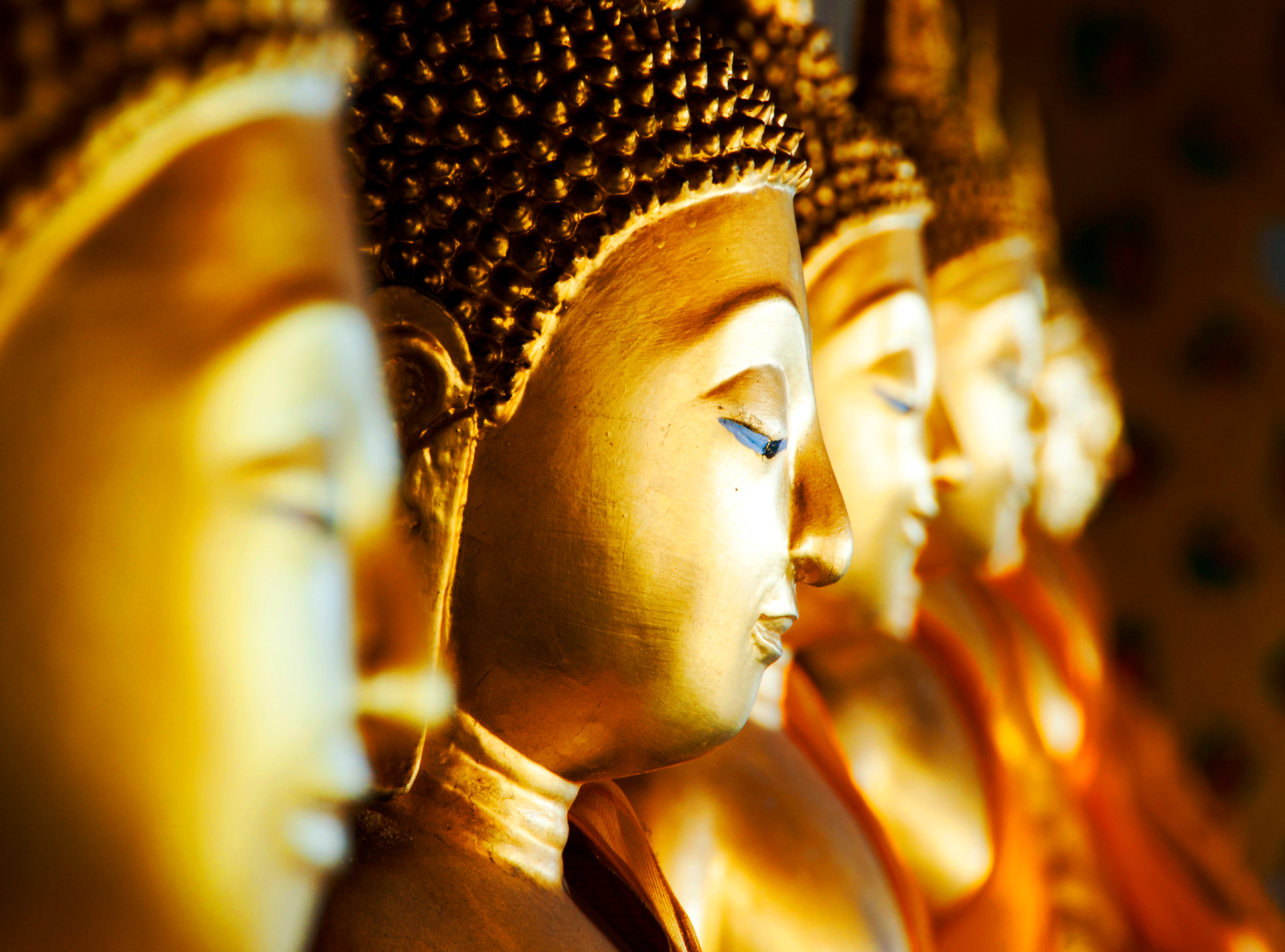 Golden Buddha statues at Wat Arun temple in Bangkok, Thailand